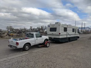 My RV towing my pickup truck on a dolly (April 2021)